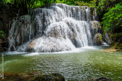 Waterfall with tons of cold water on the mountain flowing beautifully at the tier 3 in the green jungle of Huay Maekamin National Park in Kanchanaburi province  Thailand  Asia