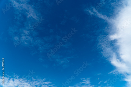 Fototapeta Naklejka Na Ścianę i Meble -  blue sky with white clouds in billowy masses and in thick fluffy ones have created a heavenly attractive texture background scenic view that is pleasant to look at on a bright sunshine day.