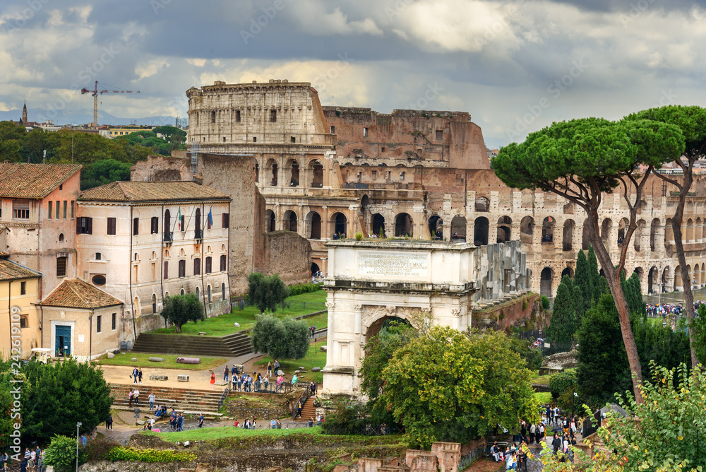 Colosseum and Ruins of Roman Forum. Arch of Titus and others. Rome. Italy Colosseum and Ruins of Roman Forum. Arch of Titus and others. Rome. Italy