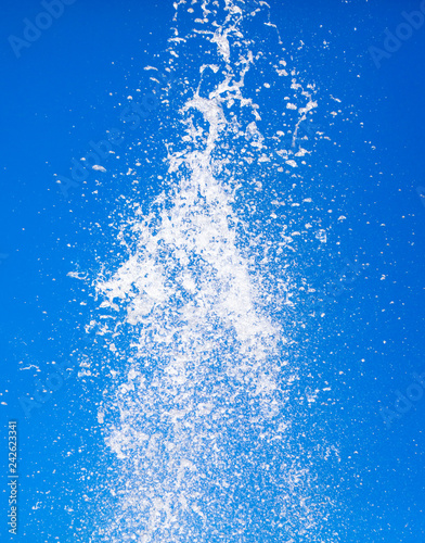 Splashes of water against the blue sky