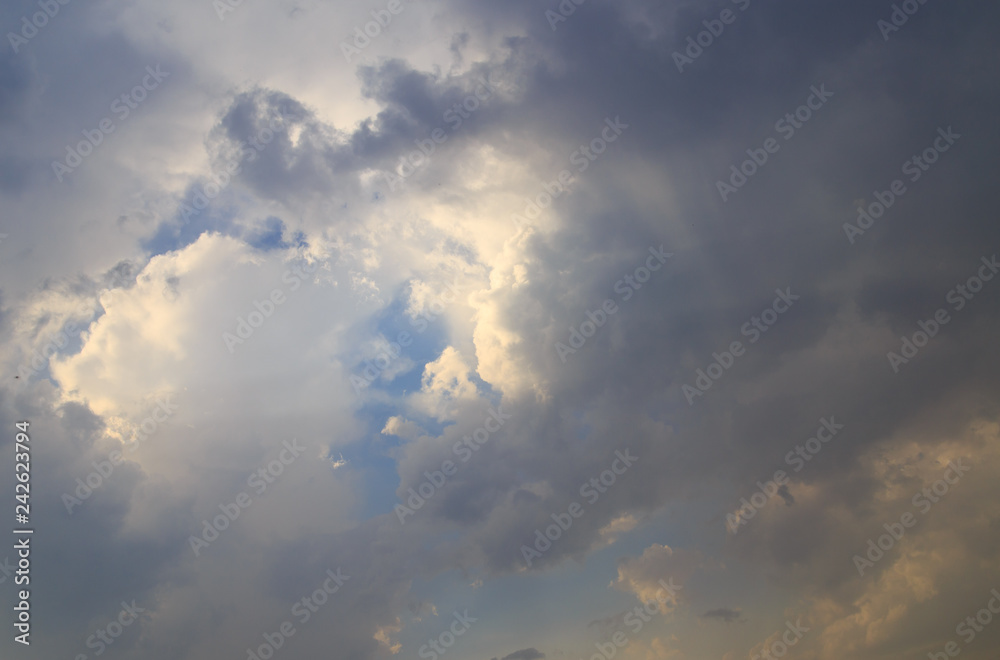 Clouds after rain before sunset as a background