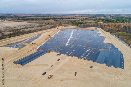 Fotografi the construction of the landfill and installation of geomembrane