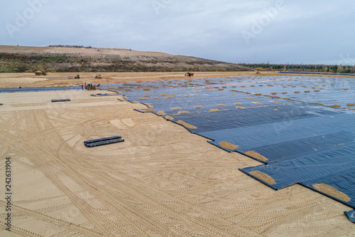 the construction of the landfill and installation of geomembrane