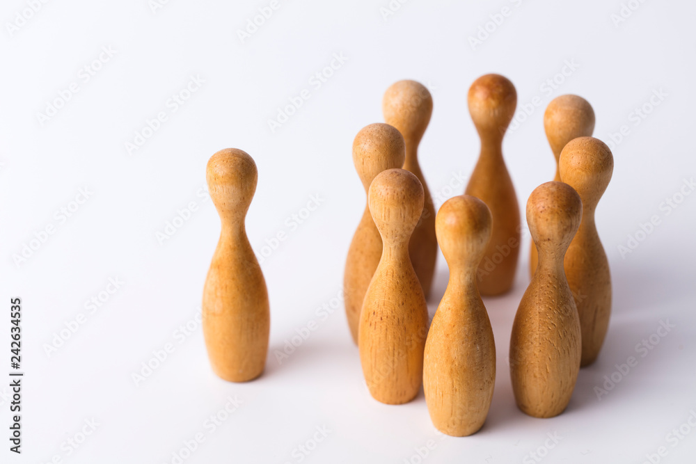 wooden figure stands out from the crowd. Business leadership concept wooden figure stands out from the crowd. Business leadership concept