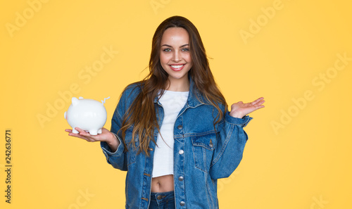 Young lady with piggy bank