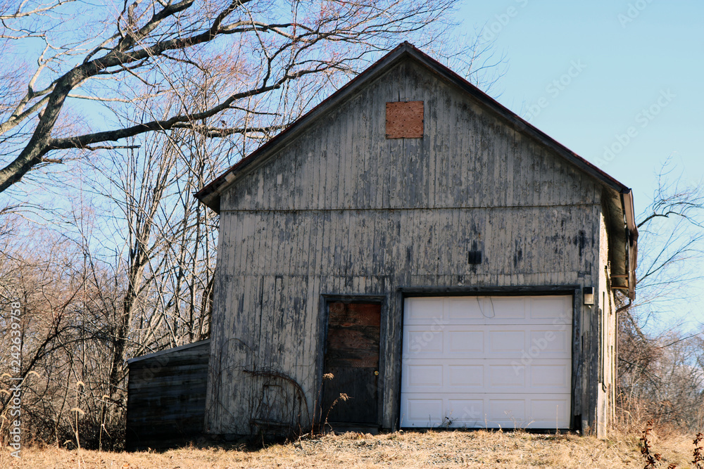 Old rustic weathered wooden barn abandoned in New England Village Old rustic weathered wooden barn abandoned in New England Village