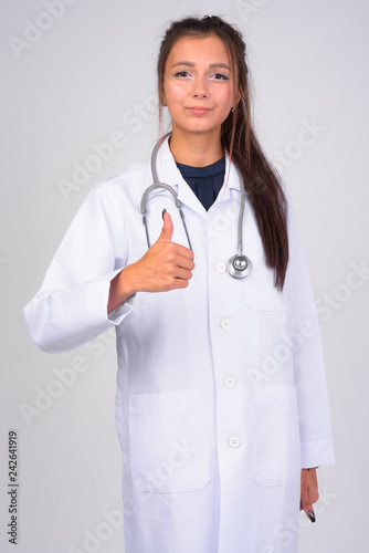 Young beautiful woman doctor giving thumbs up