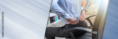 Businessman suffering from back pain, panoramic banner