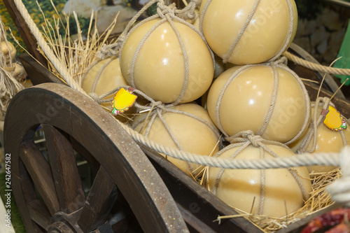 Italian Caciocavallo Cheese Placed in a Wooden Pulley with Straw