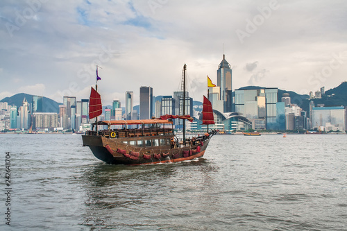 Traditional wooden sailboat sailing in victoria harbor. Hong Kong, China.