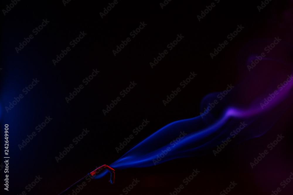 Colorful smoke close-up on a black background