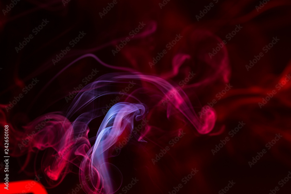 Colorful smoke close-up on a black background Colorful smoke close-up on a black background