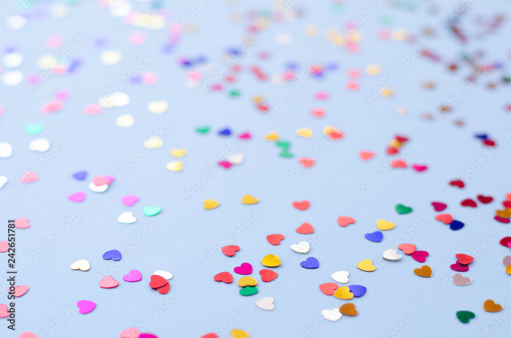 Blue background with small multicolored hearts. Blue background with small multicolored hearts.