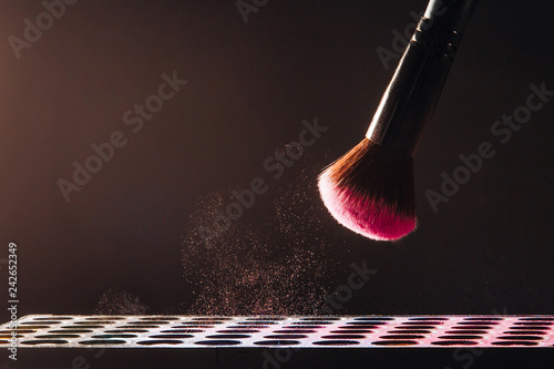 Makeup brush on black background