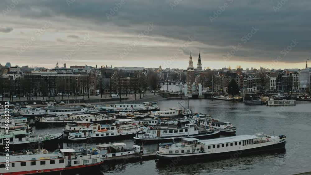 Panorama on boat dock harbour and city center of Amsterdam, Netherlands Panorama on boat dock harbour and city center of Amsterdam, Netherlands