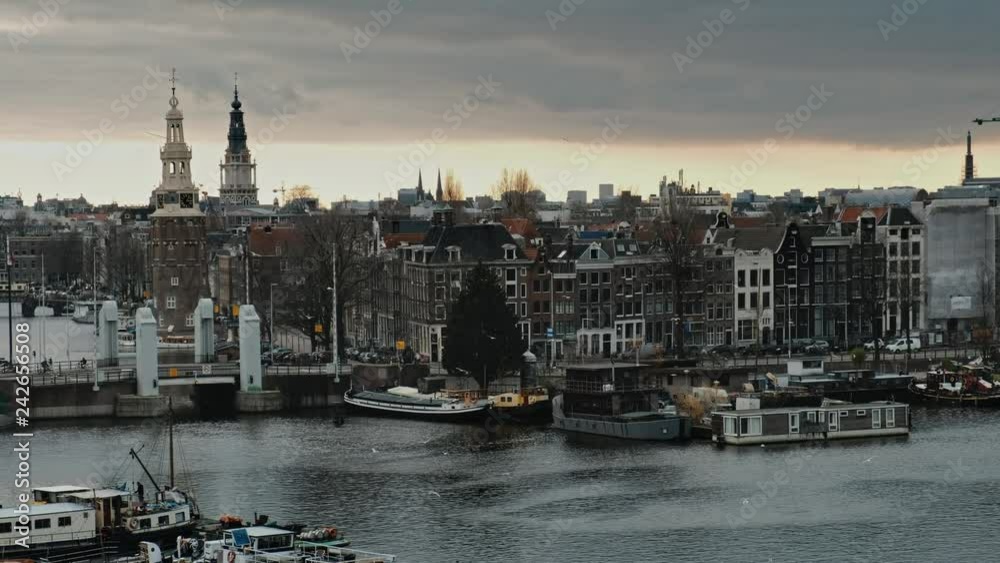 Panorama on boat dock harbour and city center of Amsterdam, Netherlands Panorama on boat dock harbour and city center of Amsterdam, Netherlands