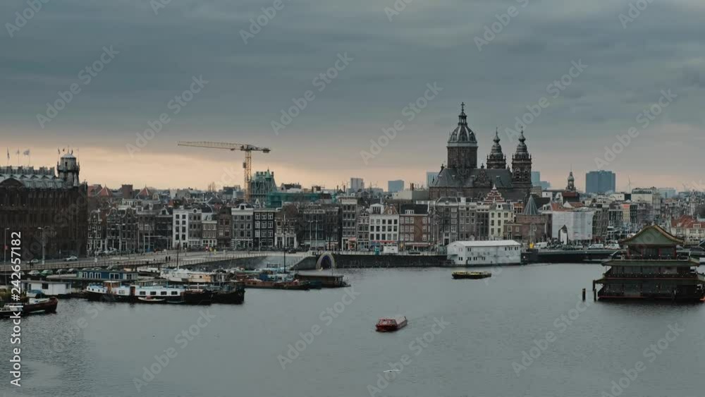 Panorama on boat dock harbour and city center of Amsterdam, Netherlands Panorama on boat dock harbour and city center of Amsterdam, Netherlands