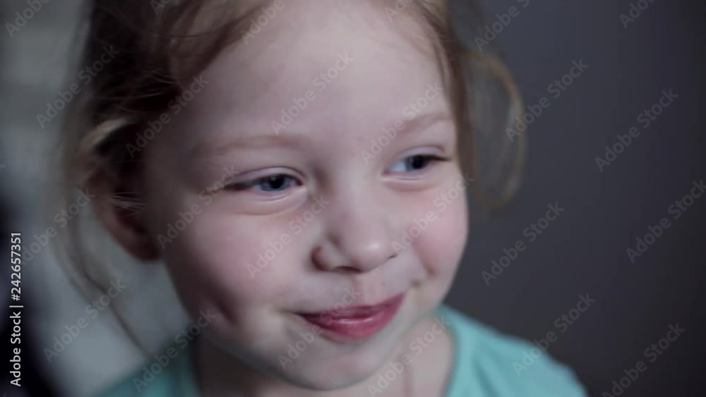 close-up portrait of Caucasian cheerful little girl with blue eyes close-up portrait of Caucasian cheerful little girl with blue eyes