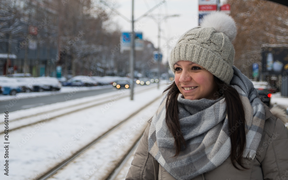 Beautiful women smiling at the winter station