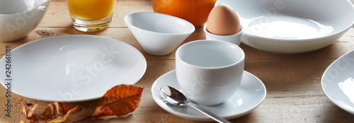 Photos Bowls and cup of white ceramic for breakfast