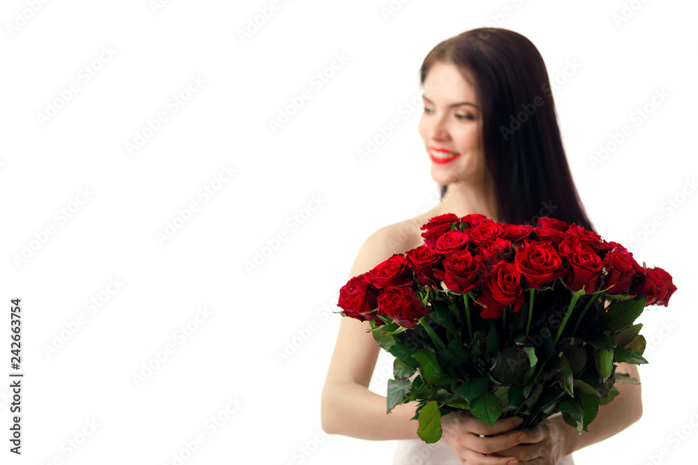 beautiful young woman with a large bouquet of red roses beautiful young woman with a large bouquet of red roses