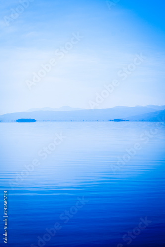 Still waters in shades of blue on Lake Champlaign