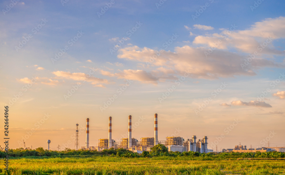 Petrochemical industrial Gas plant power station at sunset and Blue sky 