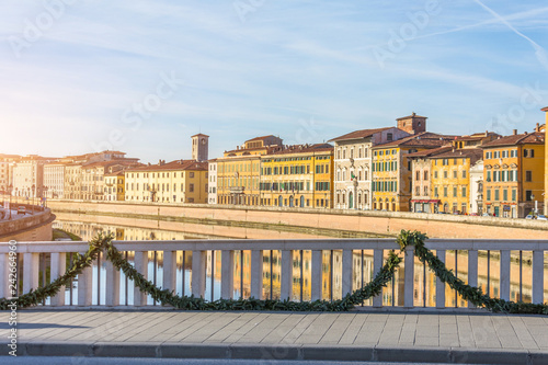 View on embankment and bridge of Arno river Pisa, Italy.