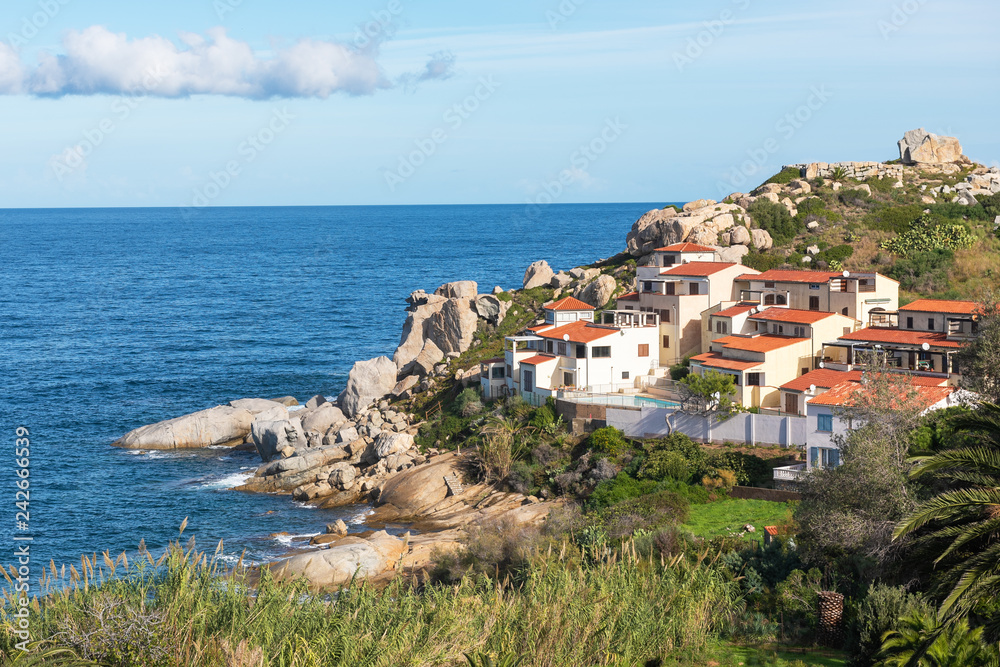 Houses on the rocky coast of Corsica, France