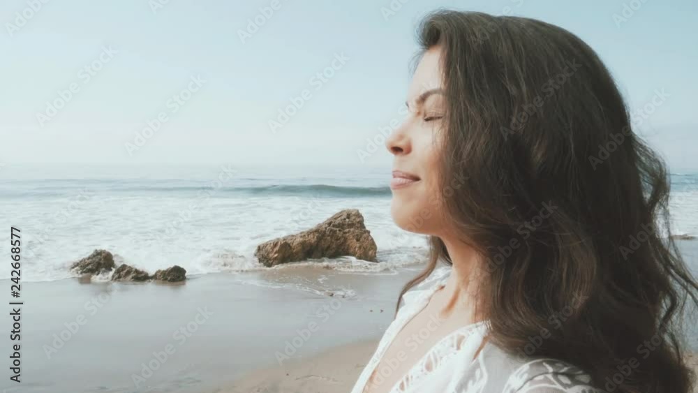 young woman happy at the beach. summer feeling