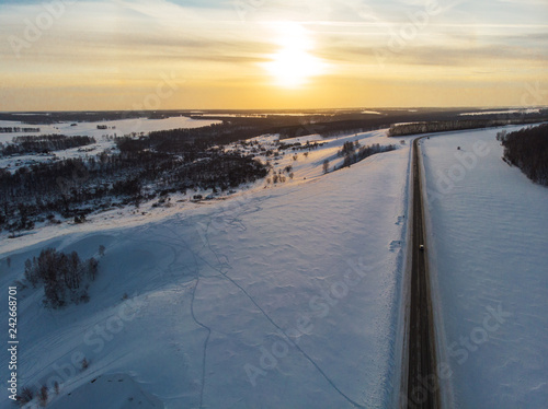 Aerial view of a road in winter landscape © olinchuk