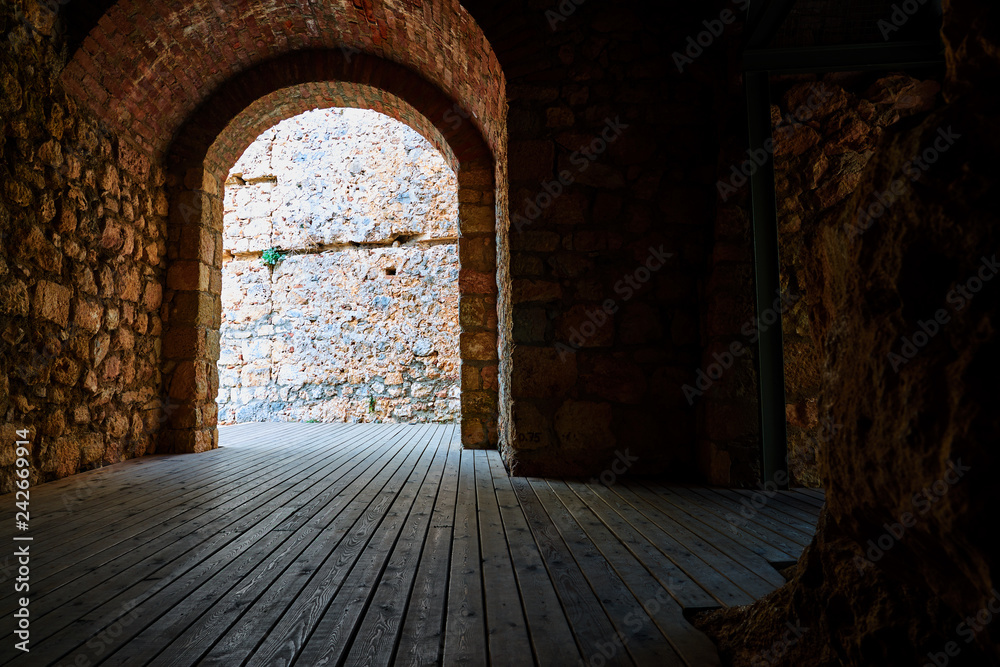 Fototapeta premium The Archway in medieval castle in Alanya, Turkey. Copy space in shadows.