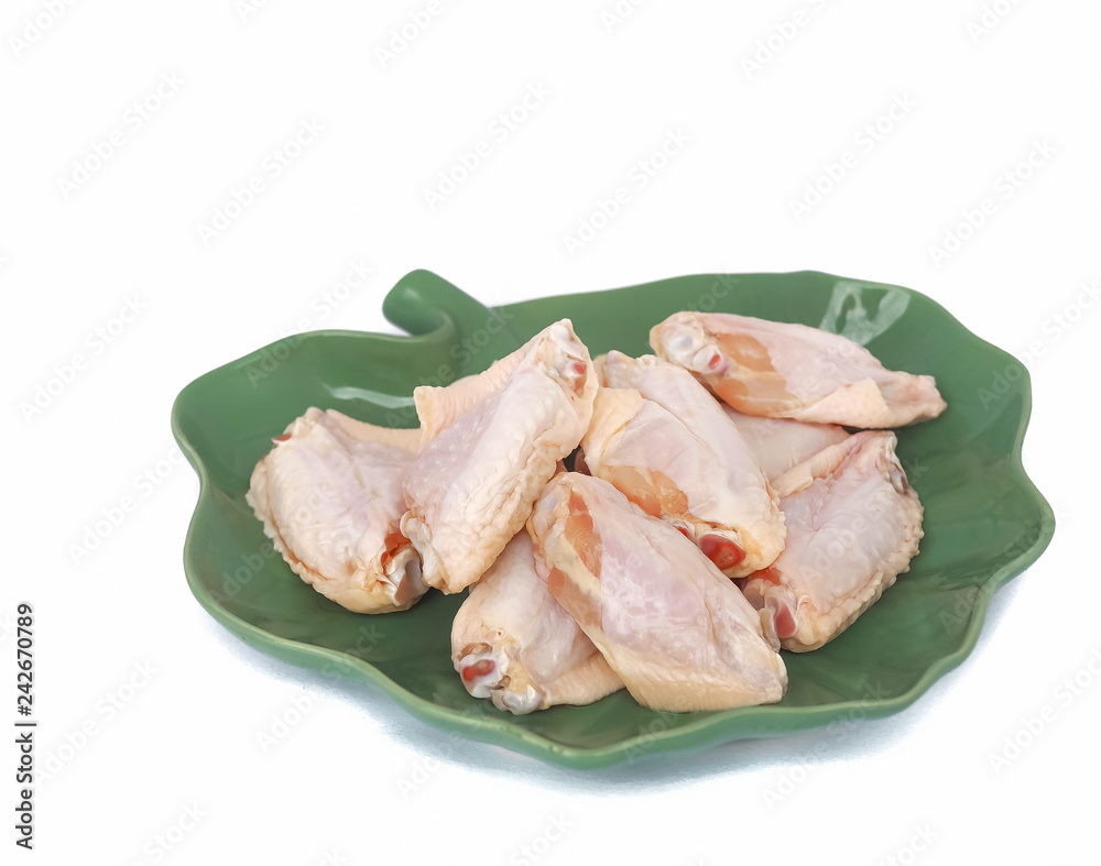 Many​ middle chicken wings on​ a dish which is a leaf shape,​ isolated​ on​ the​ white background.