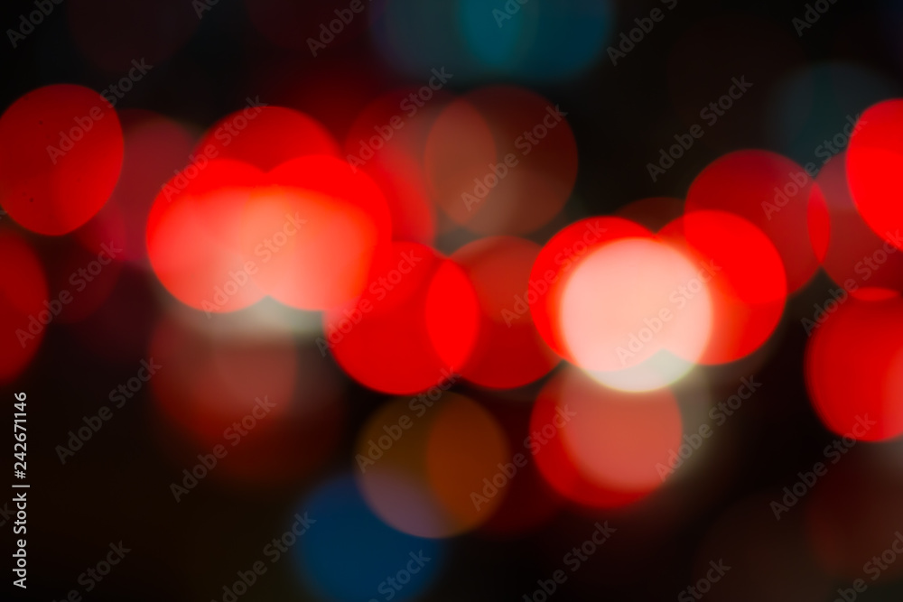 Abstract red bokeh lights on road street in city night light background, decoration in soft for greeting card backdrop with glitter sparkle blurred circles Abstract red bokeh lights on road street in city night light background, decoration in soft for greeting card backdrop with glitter sparkle blurred circles
