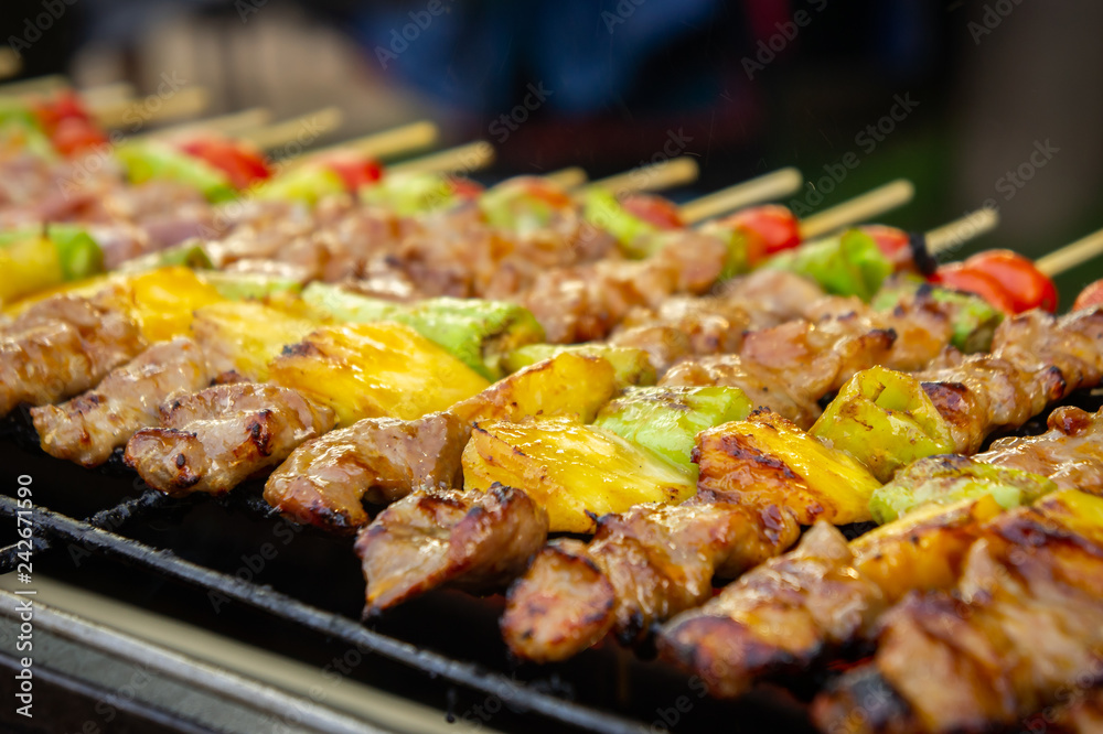 A popular barbecue with pork fillet, tomato, to taste and grill , bar-b-q on hot grill