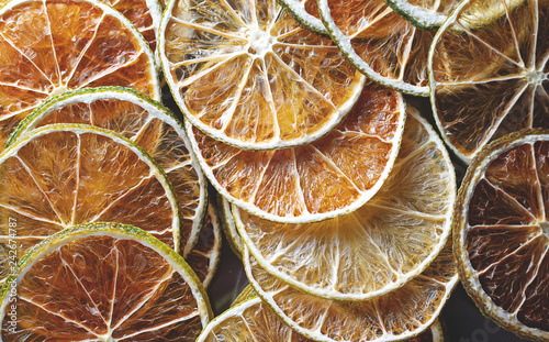 Dried colorful slices of lemon the lime and orange background