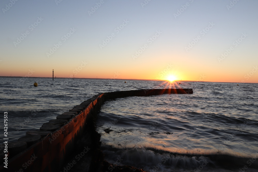 Obraz premium Coucher de soleil sur le bassin d'arcachon