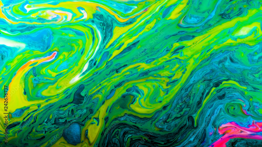 Green psychedelic abstract bright colors are mixed in a liquid Green psychedelic abstract bright colors are mixed in a liquid