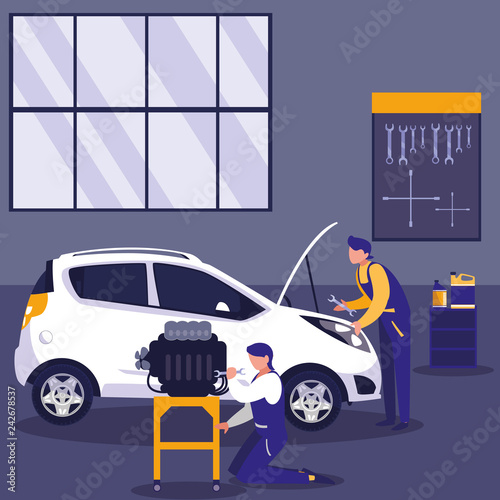 car in maintenance workshop with mechanics team