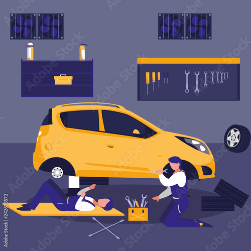 car in maintenance workshop with mechanics team