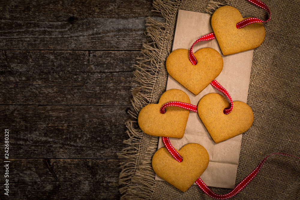 Valentines Day Heart Shaped Cookies on Wooden Background. Valentines Day Background. Selective focus. Valentines Day Heart Shaped Cookies on Wooden Background. Valentines Day Background. Selective focus.