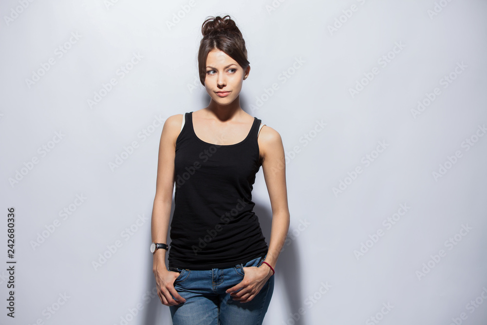 Portrait of a pretty smiling woman posing isolated on a white background. Portrait of a pretty smiling woman posing isolated on a white background.