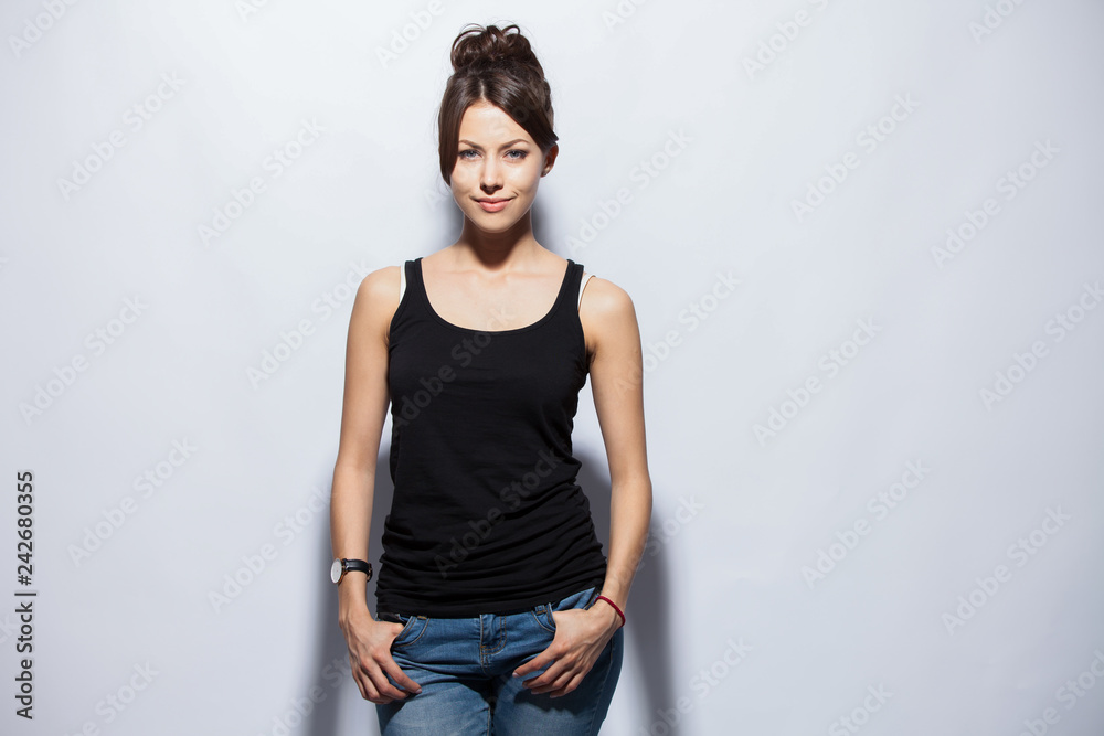 Portrait of a pretty smiling woman posing isolated on a white background. Portrait of a pretty smiling woman posing isolated on a white background.