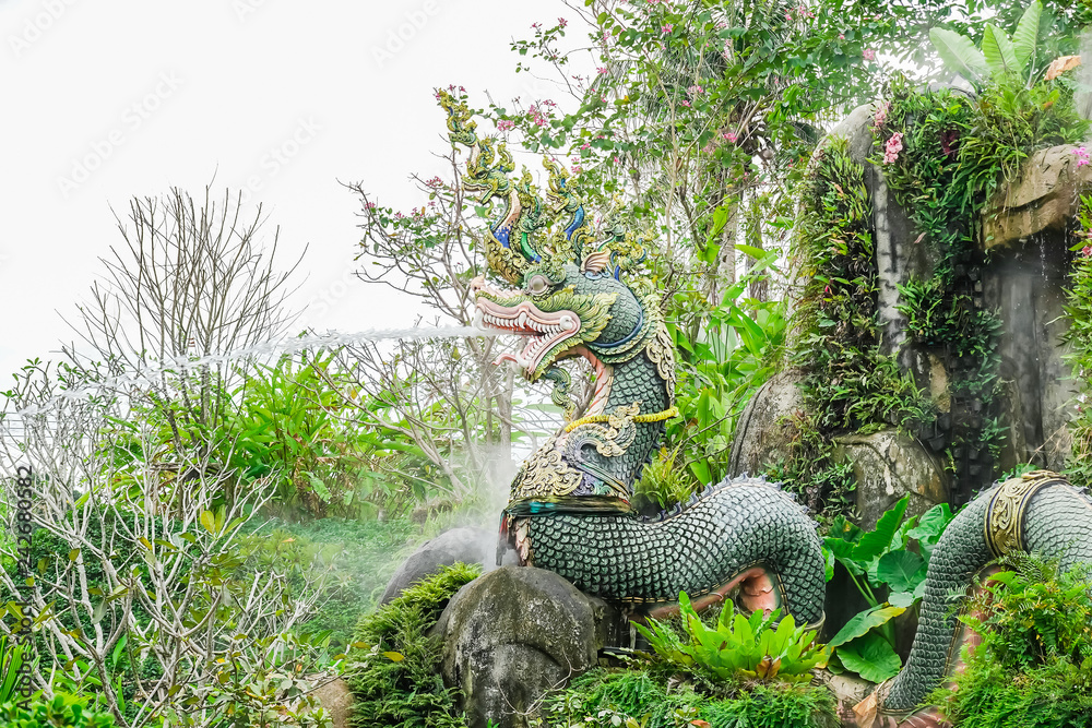 Statue on natural background, waterfall model is beautiful, For tourists to photograph in tourist attractions,Suanthai Pattaya Statue on natural background, waterfall model is beautiful, For tourists to photograph in tourist attractions,Suanthai Pattaya