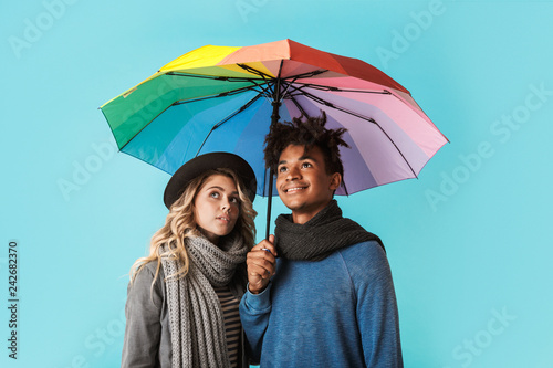 Smiling young multiracial couple wearing scarves