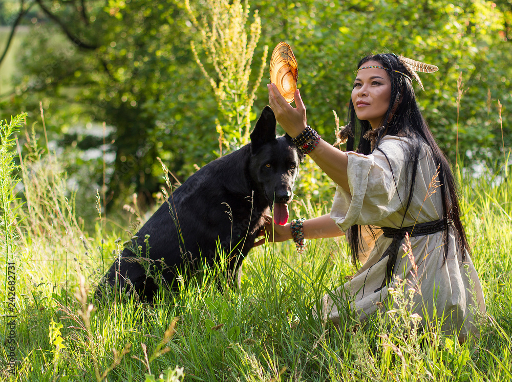 woman shaman talking to a dog woman shaman talking to a dog