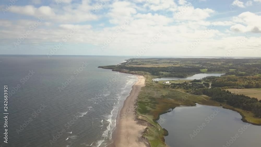 Aerial view of a beautiful sandy beach on the Atlantic Ocean. Taken in Cavendish, Prince Edward Island, Canada. Aerial view of a beautiful sandy beach on the Atlantic Ocean. Taken in Cavendish, Prince Edward Island, Canada.