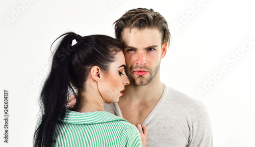 Man and woman couple in love cuddle or hug on white background. Valentines day and love. Romantic feelings concept. Romantic couple in love hug. Handsome unshaven man and pretty girl in love