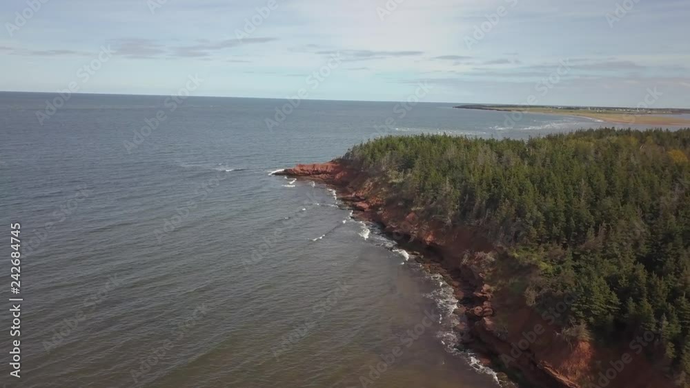 Aerial view of a beautiful rocky shore on the Atlantic Ocean. Taken in Cabot Beach Provincial Park, Prince Edward Island, Canada. Aerial view of a beautiful rocky shore on the Atlantic Ocean. Taken in Cabot Beach Provincial Park, Prince Edward Island, Canada.