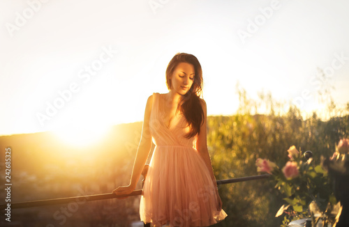 Wallpaper Mural Beautiful girl enjoying the sunset from a terrace Torontodigital.ca